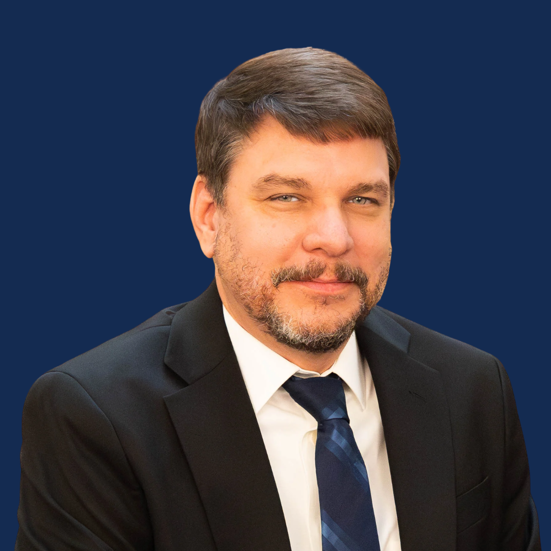 David Resler - Headshot (blue bkg) (1)