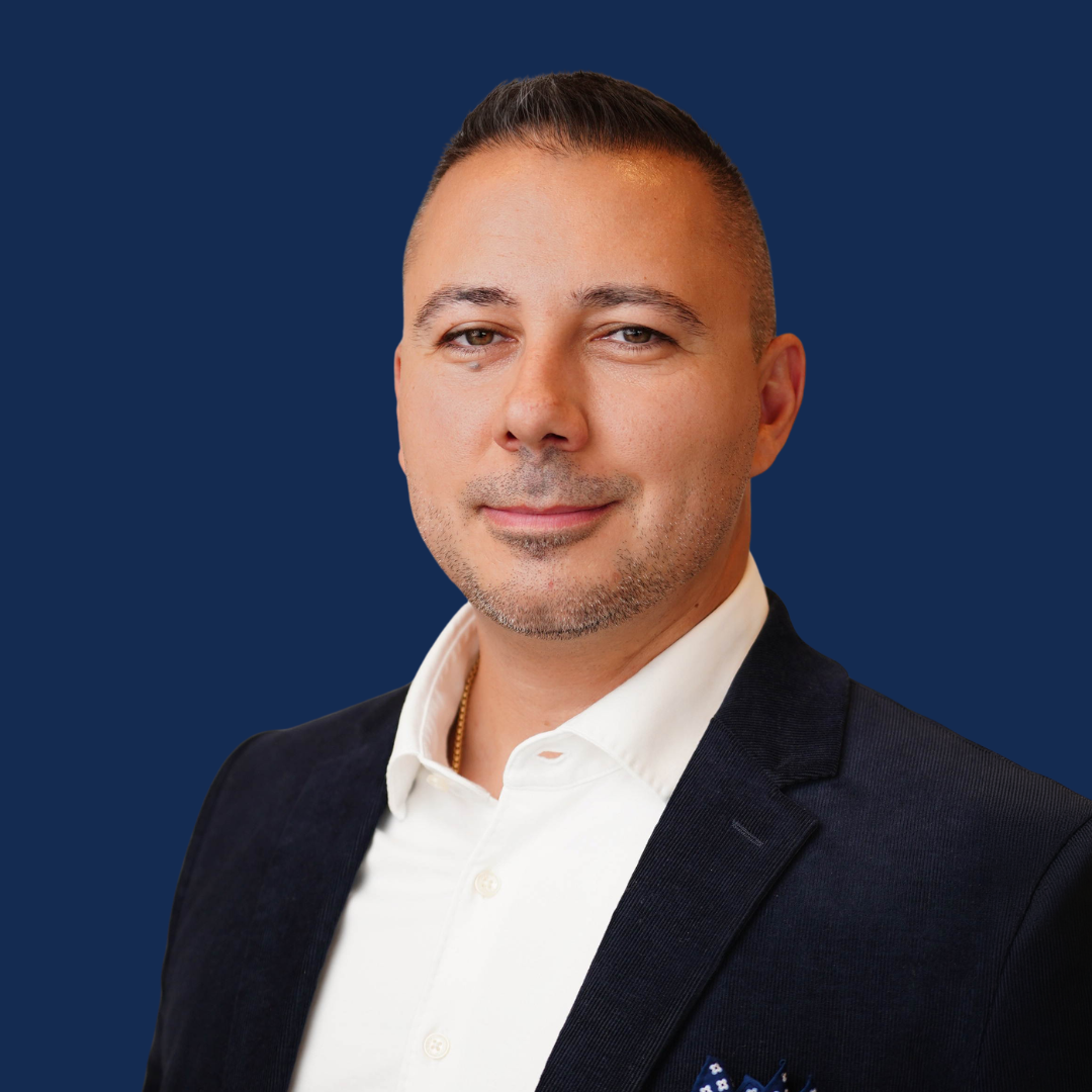 Petar Besalev - Headshot (blue bkg)